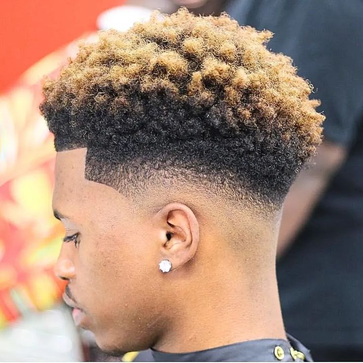 Color-led fade with textured curls at Culture Kutz Nyali